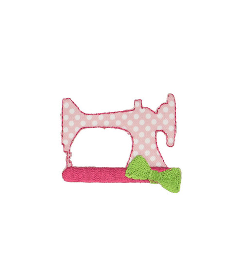 Pink sewing machine badge with white polka dots