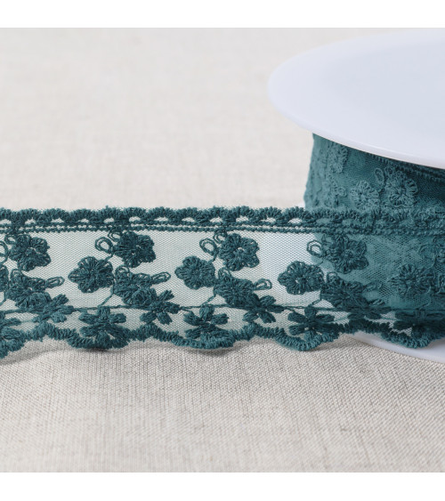 Embroidered tulle with small matte flowers 44mm duck blue per meter