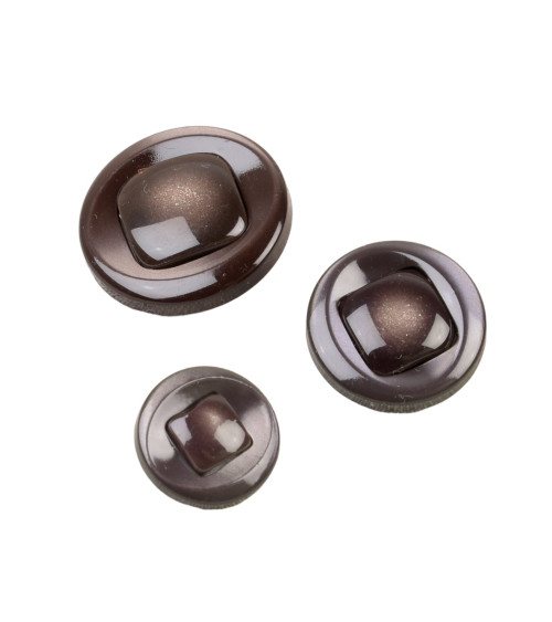 Round button with brown shank